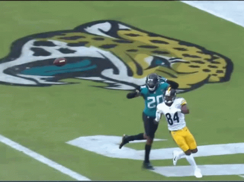 Football Player Number 84 Trying to Catch Ball
