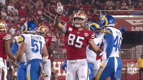 Football Player Number 85 Congratulated By Teammates GIF