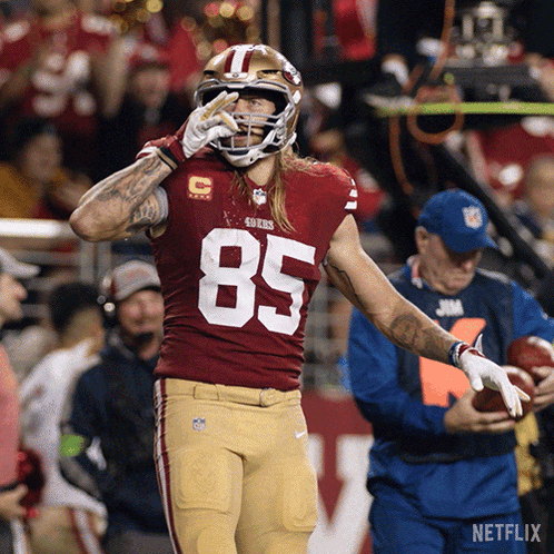 Football Player Number 85 Running on Field