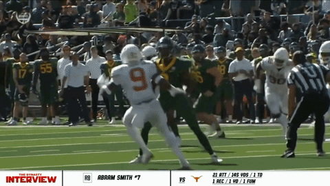 Football Player Number 9 Being Tackled