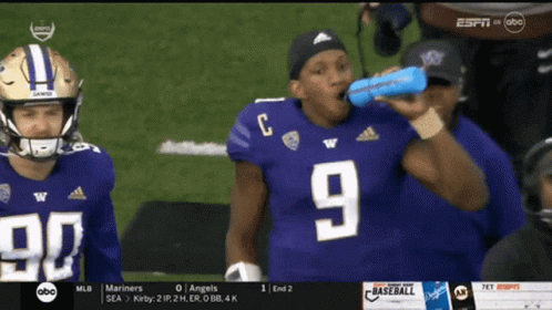 Football Player Number 9 Drinking From Blue Bottle GIF
