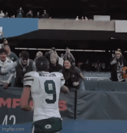 Football Player Number 9 in Front of Crowd