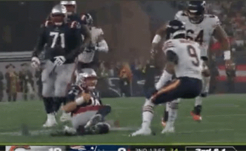 Football Player Number 9 Kneeling Down