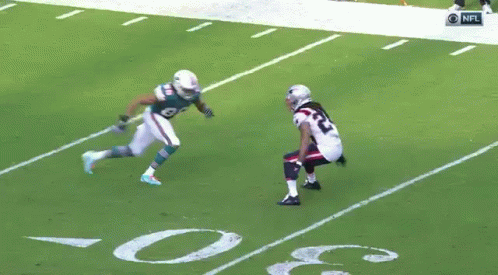 Football Player Number 94 Running on Field