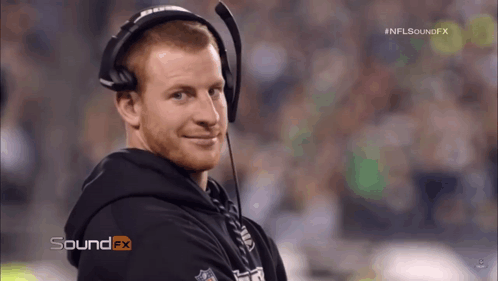 Football Player Number 95 Helmet Stands In Front Of Camera GIF