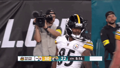 Football Player Number 95 In Front Of Camera GIF