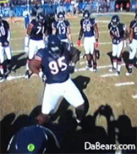 Football Player Number 95 Running With Ball