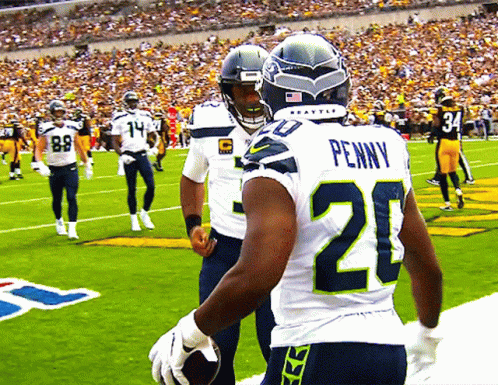 Football Player Penny On Back GIF