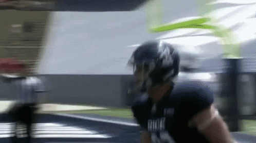 Football Player Running In Helmet And Gloves GIF