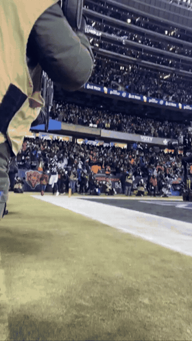 Football Player Running In Purple Jersey And Helmet GIF