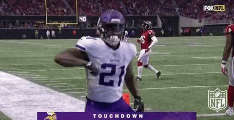 Football Player Running On Field In Purple Jersey Number 21 GIF
