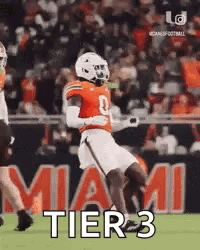 Football Player Running on Field