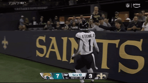 Football Player Running On Field With Scoreboard Saying TNF GIF