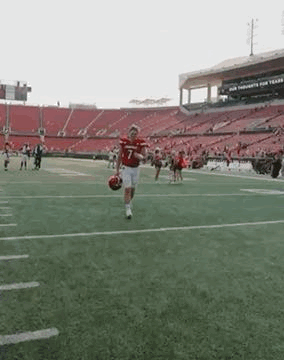 Football Player Running With Ball