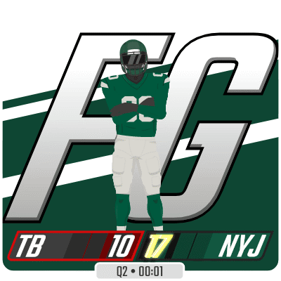 Football Player Standing in Front of NYJ Scoreboard