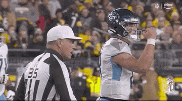 Football Player Standing Next To Referee GIF