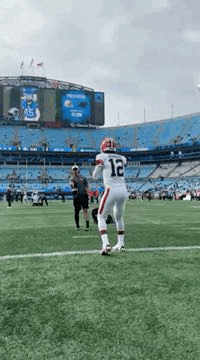 Football Player Standing on Field