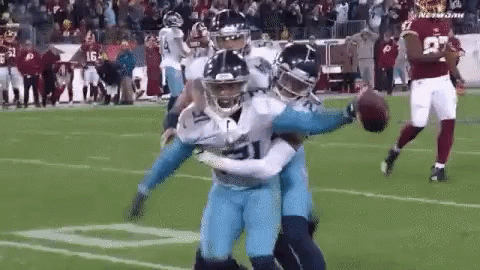 Football Player Tackled on Field