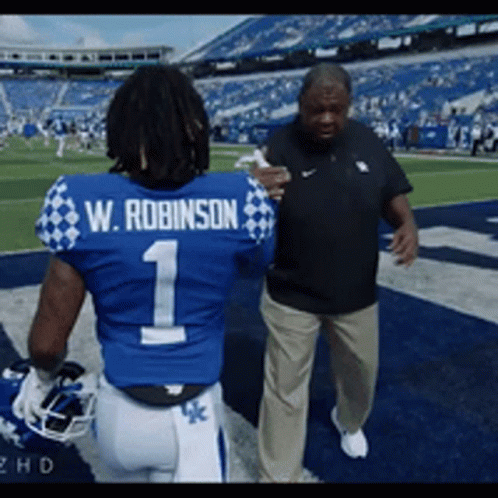 Football Player W Robinson Talking To Coach GIF