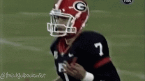 Football Player Wearing G Helmet