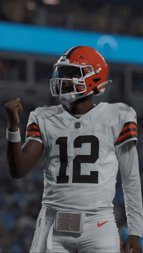 Football Player Wearing Helmet and Number 12 Jersey