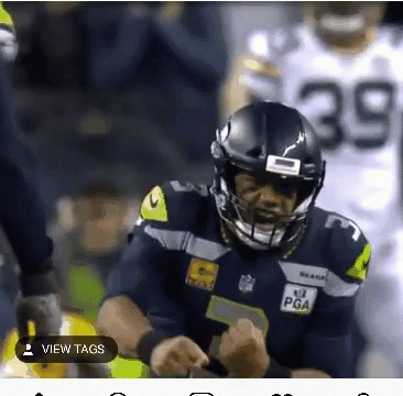 Football Player Wearing Helmet Number 39