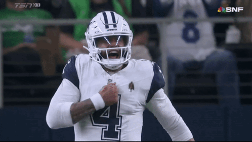 Football Player Wearing Helmet Number 4