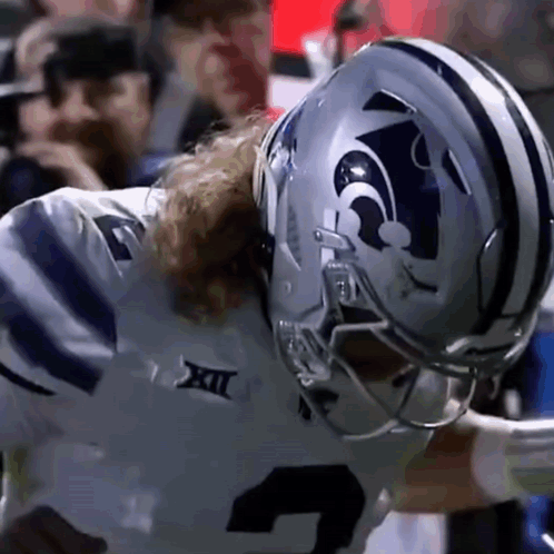 Football Player Wearing Helmet That Says XII