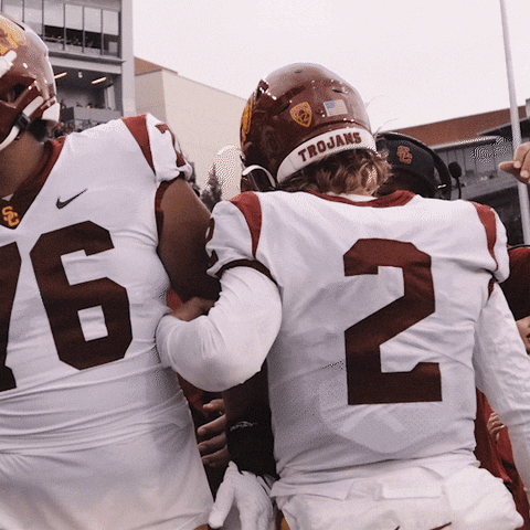 Football Player Wearing Trojans Helmet