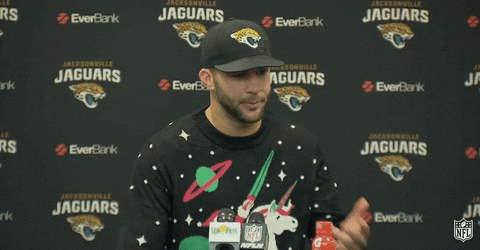 Football Player Wearing Ugly Sweater GIF