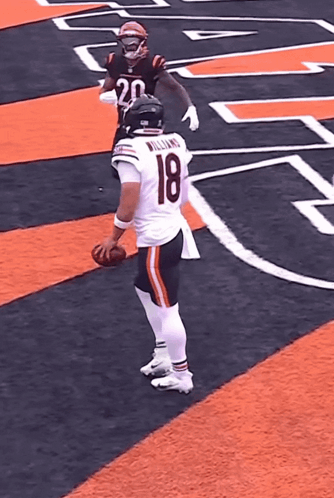 Football Player Williams Holding Football