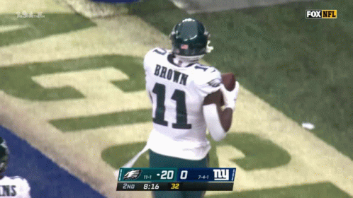 Football Player With Brown Name on Back