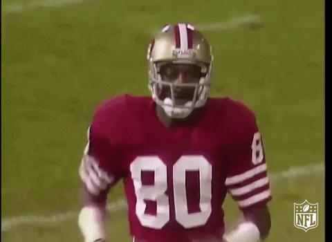 Football Player With Helmet and Red Jersey Number 80