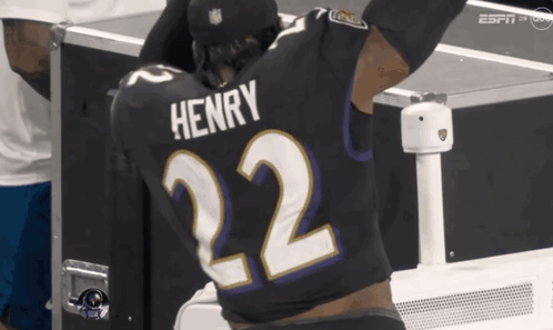 Football Player With Henry on Shirt