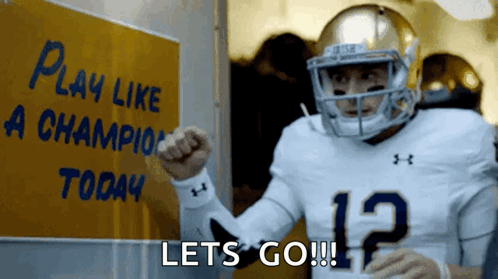 Football Player With Sign Play Like a Champion Today
