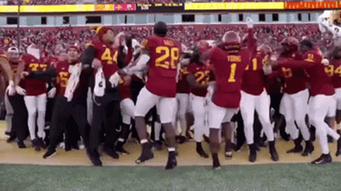 Football Players Dancing With Number 1 Jersey GIF