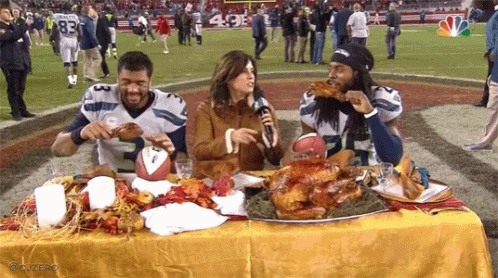 Football Players Eating Turkey