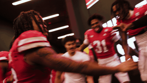 Football Players Huddled Number 31