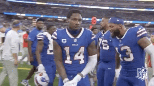 Football Players in Blue Uniforms Walking