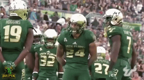 Football Players in Green Uniforms Bullpen