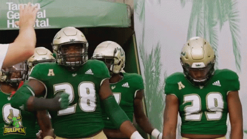 Football Players in Green Uniforms Number 28