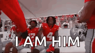 Football Players in Huddle Saying I Am Him