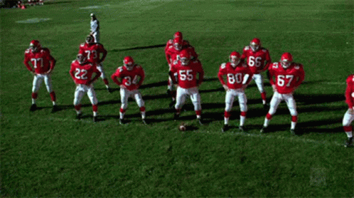 Football Players in Red Uniforms Number 55