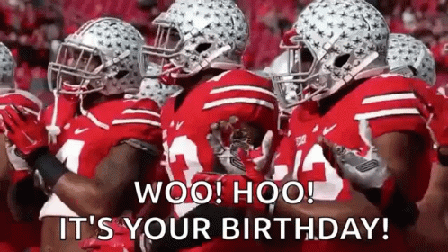 Football Players in Red Uniforms Standing in Line