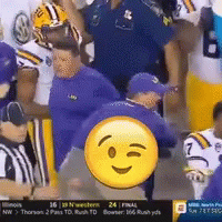 Football Players in Stadium with Smiley Face