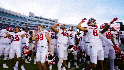 Football Players in White Uniforms With Letter R