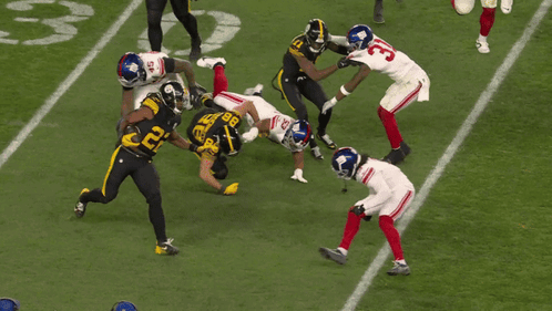 Football Players Including Number 33 GIF