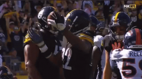 Football Players Including Number 65 And Reed GIF