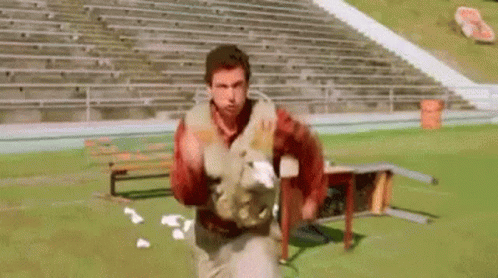 Football Players Lined Up On Field GIF