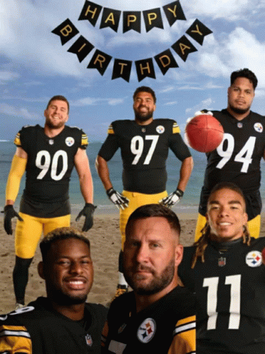 Football Players on Beach With Happy Birthday Banner